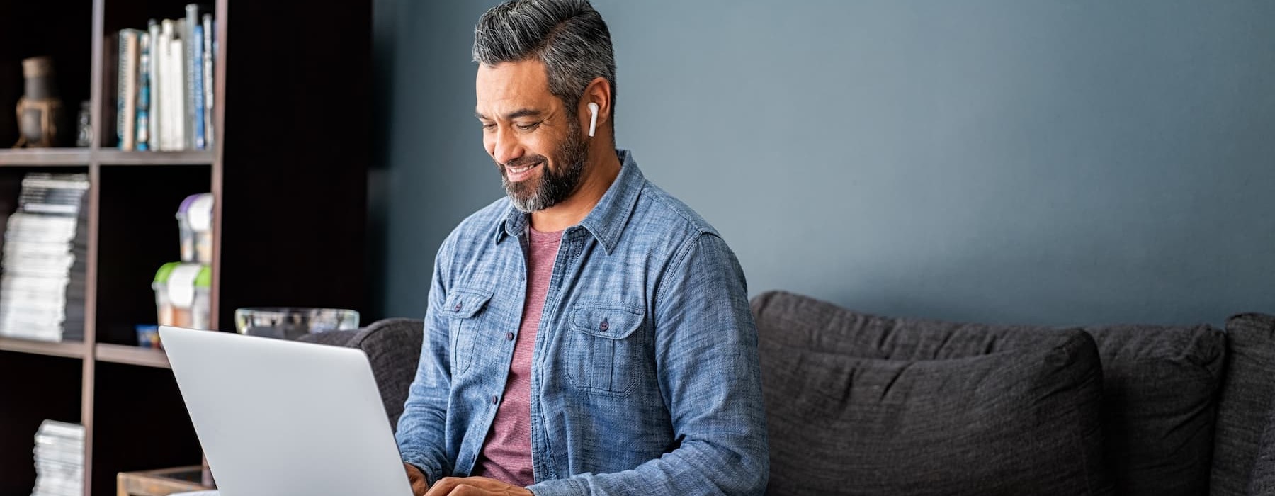 lifestyle image of a man working on his laptop